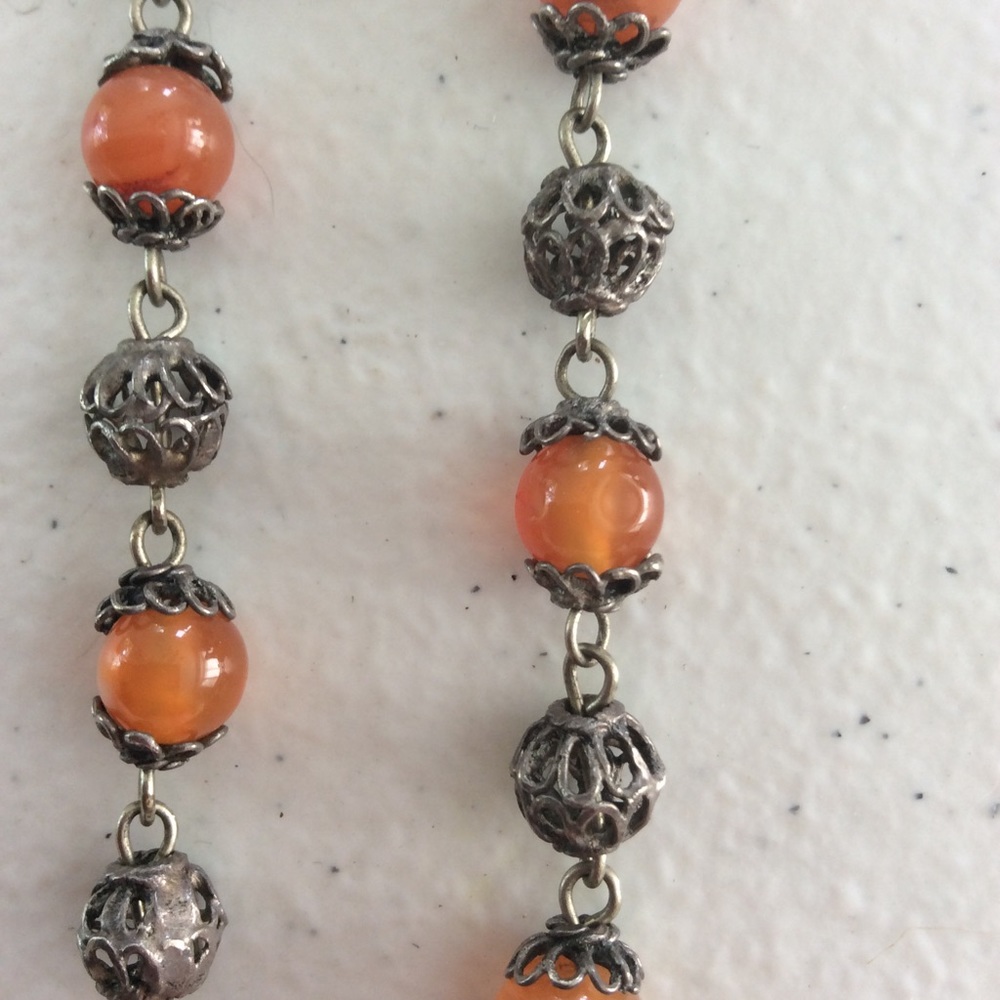 Silver and amber beaded necklace.